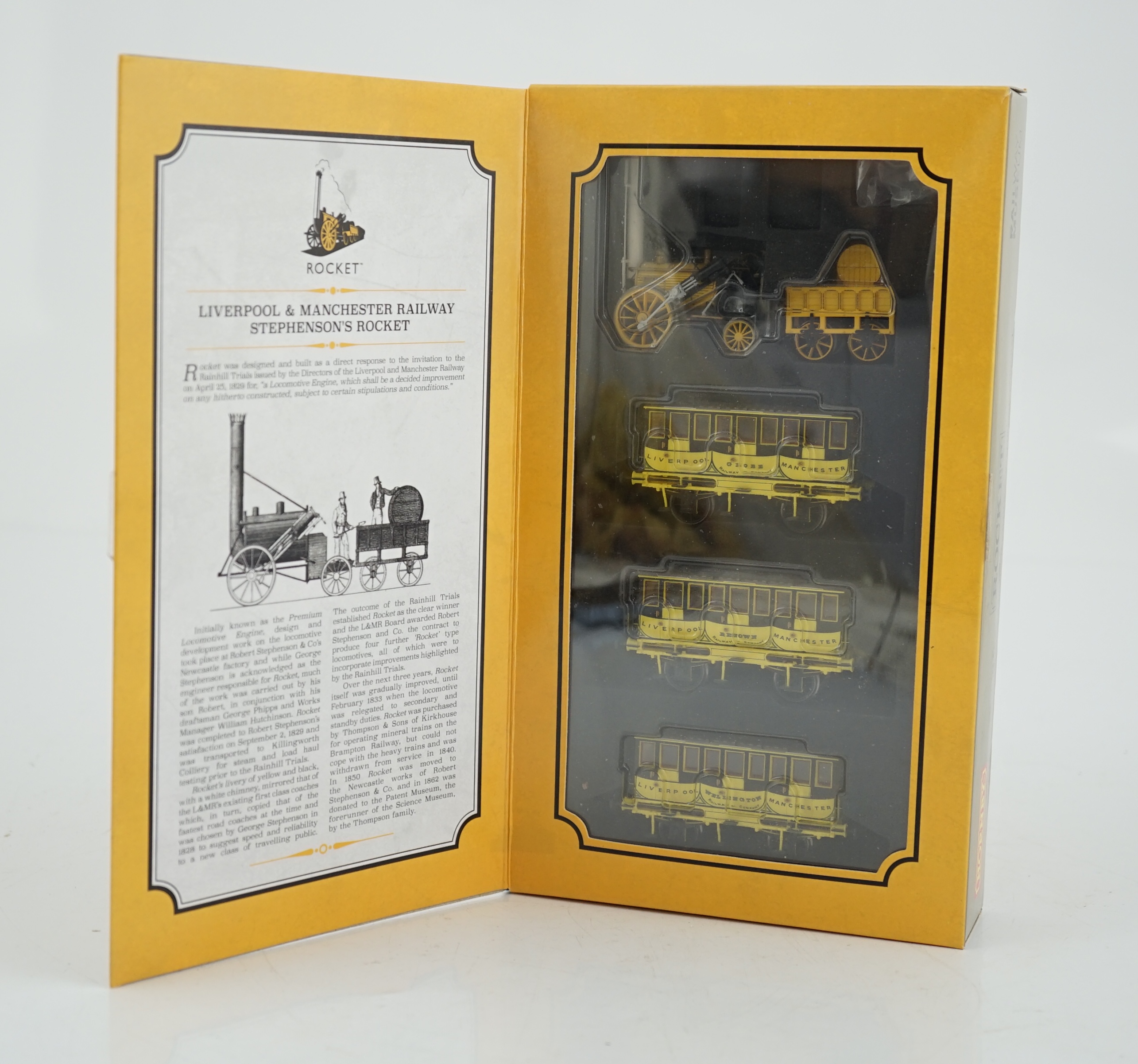 A Hornby Hobbies 00 gauge Rocket train pack (R3810), comprising of Stephenson’s locomotive Rocket and three Liverpool and Manchester 4-wheel coaches